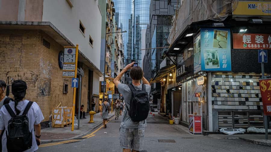A Day in the life of a Hong Konger Tip Based Walking Tour - Livestock Markets and Municipal Buildings with Restaurants Above