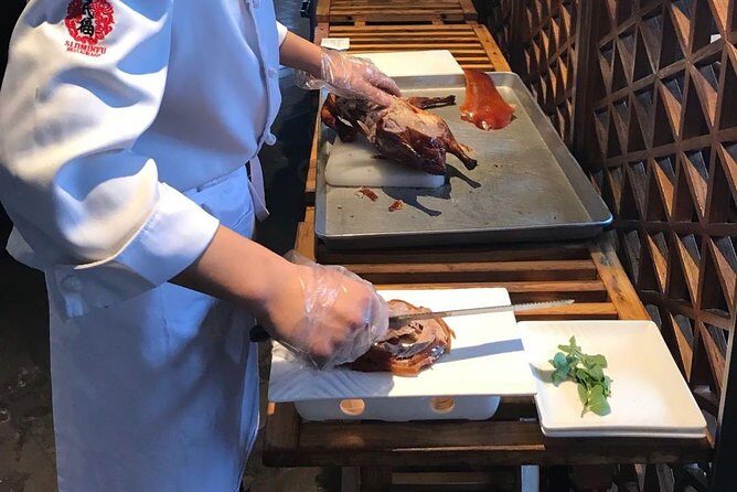 Beijing: Acrobatic Show with Peking Duck Dinner Private Tour - Red Theater Acrobatics: What You Get From Middle Back Seats