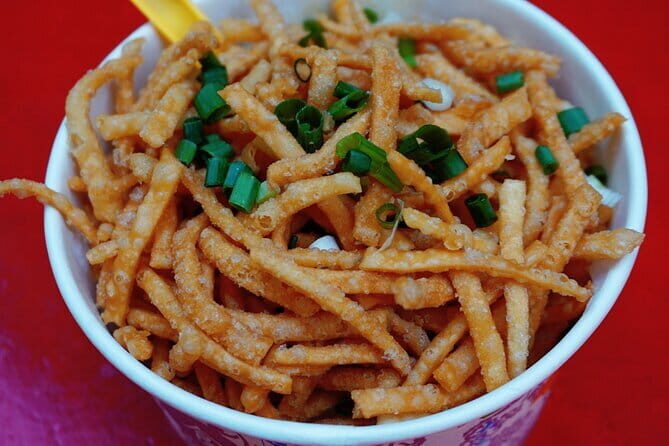 Chongqing Local Food Tour Adventure - Jiefangbei Pedestrian Street: Snack Stops with Context