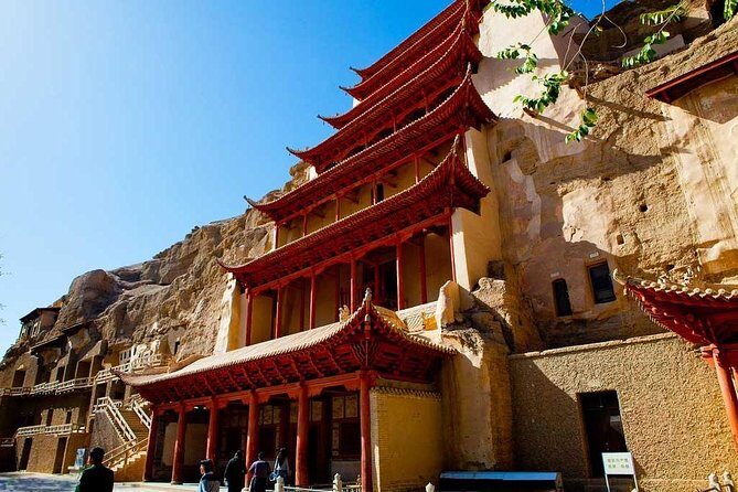 Dunhuang Private Day Tour Mogao Grottoes, Singing Dunes and Crescent Moon Spring - Inside Mogao: frescoes, statues, and why the guide changes everything