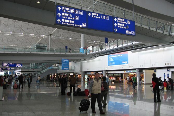 Hong Kong Private Arrival Transfer Driver Meet and Greet: Airport to Hotel - Meeting the driver at HKIA: Arrivals Hall A, tablet sign, and the walk to the car
