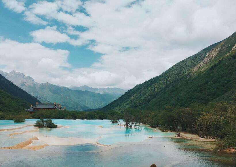 Huanglong Scenic Area: Explore Stunning Five-Colored Ponds - Golden Sand Pavement: The Travertine Beach Flow Moment