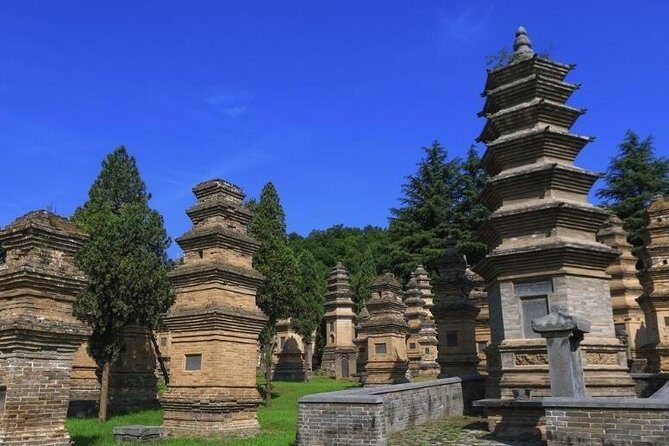 Luoyang Private Day tour to Longmen Grottoes and Shaolin temple - Longmen Grottoes: Caves, Inscriptions, and 100,000+ Figures