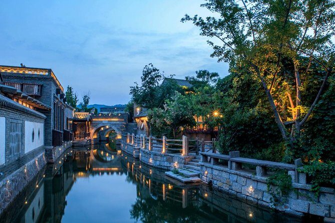 Private Evening Tour to Simatai Great Wall and Gubei Water Town - Gubei Water Town after dark: lights, fountains, and that 8:00 pm moment