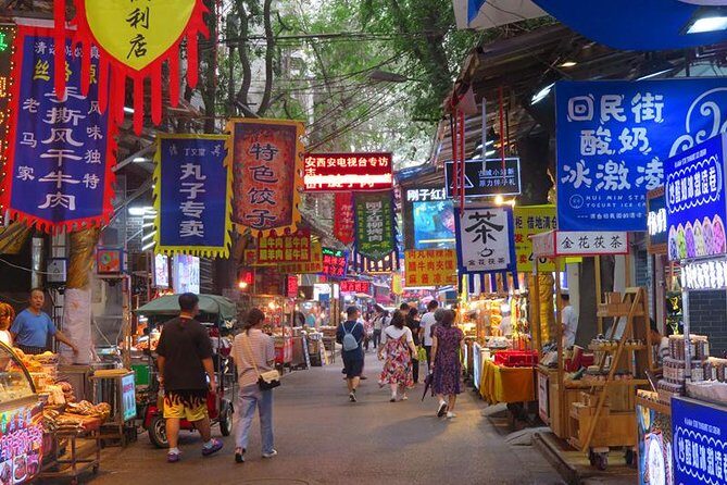 Private Xi’an Night & Food Tour by Tuk Tuk and Public Transportation - Big Wild Goose Pagoda at night: Dayanta views plus exam-era stories