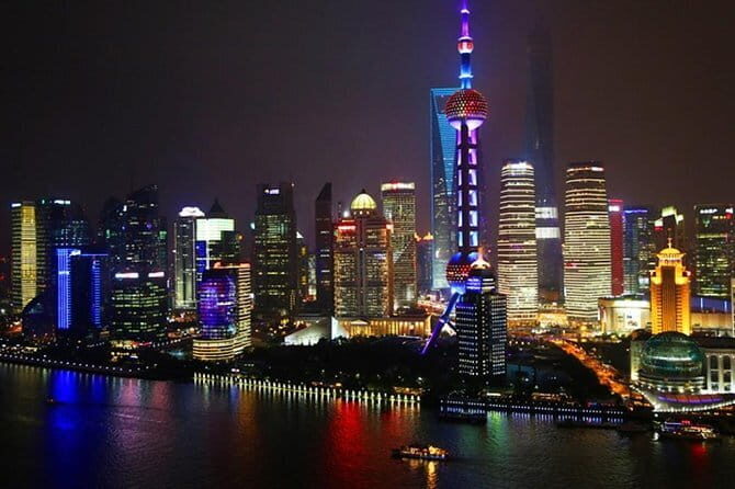 Shanghai by Night with Fine Local Dinner and VIP River Cruise Experiences - How the Guide Adds Meaning to Neon Landmarks