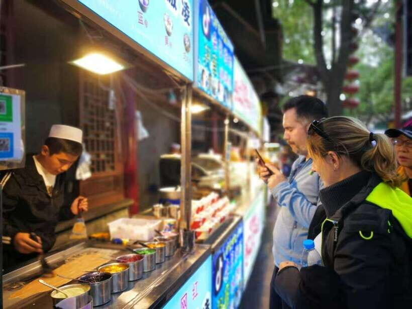 Xi'an: City Wall & Old Town Walking Tour w/ 10+ Food Tasting - Price and logistics: what $16 really buys