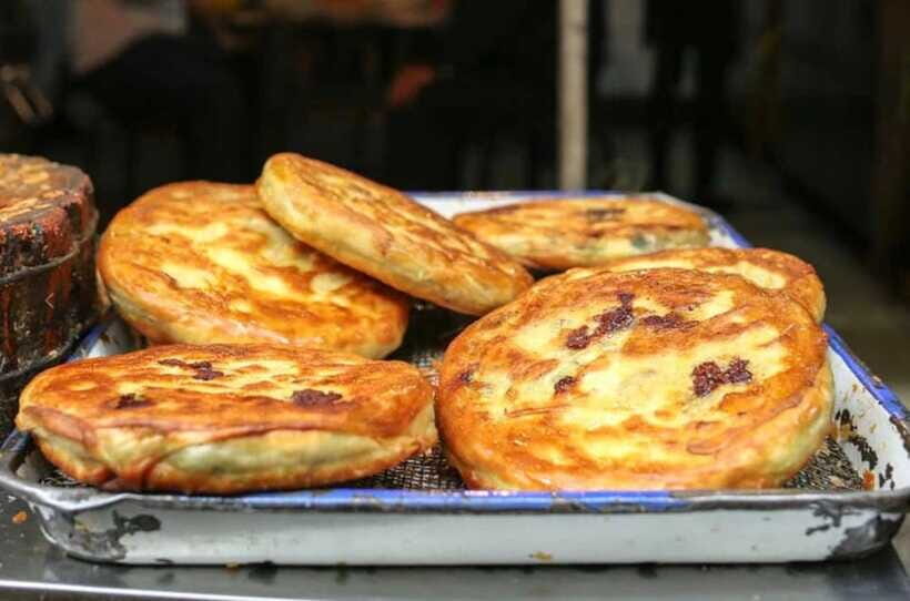 Xian: Morning Food Tour of the Muslim Quarter - Neighborhood service: eating where people actually live next door