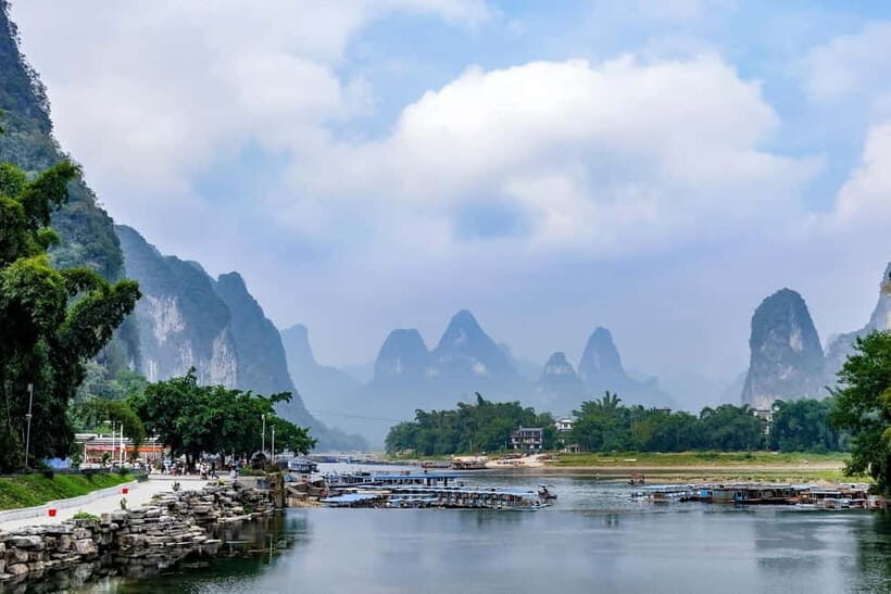 Yangshuo Unveiled: Karst View, Bamboo Drift & Hidden Village - Thousand Miles mural on the cliffs: your fastest photo win